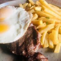 Bife À Cavalo - Ny Strip · char-grilled NY strip topped with fried eggs. Served with fries