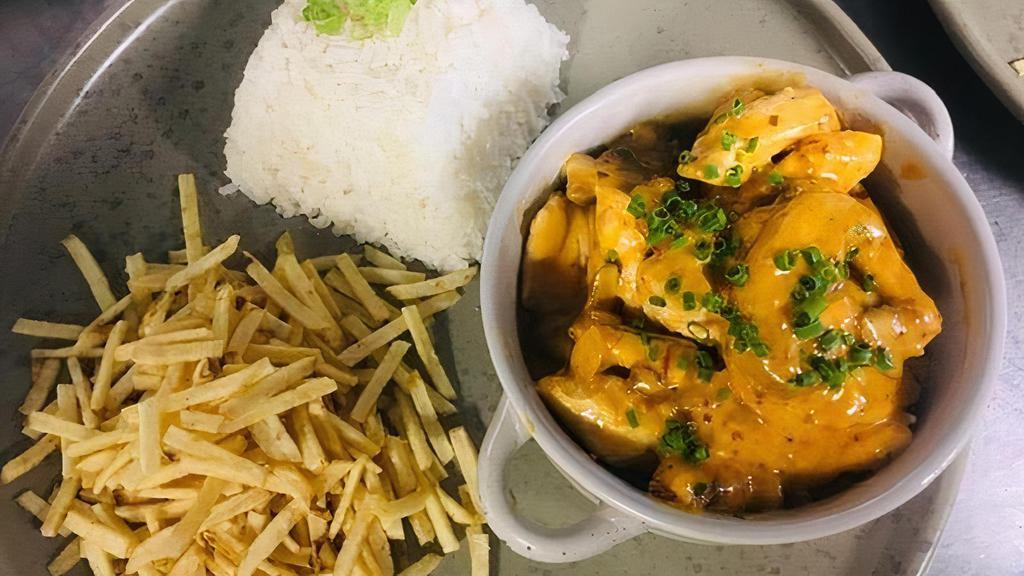 Strogonoff De Frango · strips of chicken file and mushrooms sautéed in a delicious cream sauce. Served with rice and potato sticks