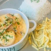 Strogonofe De Camarao · delicious creamy sauce with shrimps and mushrooms. Served with white rice and stick potatoes
