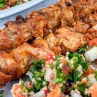 Chicken Skewers Platter · Two roasted chicken skewers, tabbouleh salad, and hummus dip.