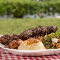 Trio Skewers Platter · One skewer beef, chicken, or kafta, tabbouleh salad, and hummus dip.
