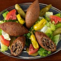 Fried Kebbe · Three football shaped beef shells stuffed with sautéed beef, onions, and pine nuts, then dee...