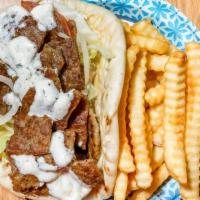 Gyro Combo · Lamb or chicken gyro. Cucumber sauce, lettuce, onions and tomato served with french fries an...