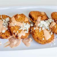 Fried Green Tomatoes · Fried green tomatoes served with goat cheese crumbles and remoulade sauce.