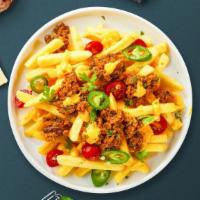 Chunky Chili Cheese Fries · Idaho potato fries cooked until golden brown and garnished with salt, melted cheddar cheese,...