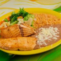 6 Oz Grilled Salmon · Comes with rice and beans or steamed vegetables.