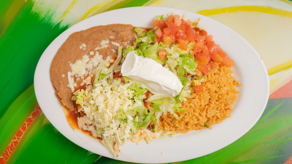 One Taco, Mexican Rice And Refried Beans · One crunchy taco filling  with lettuce and shredded cheese . served with rice and beans.