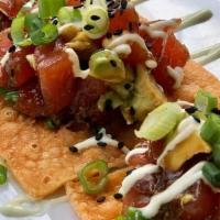 The Best Tuna Nachos · dressed tuna + crispy wonton + wasabi crema + avocado + jalapeño soy glaze + wakame