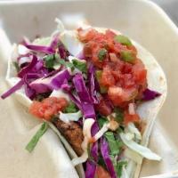 Blackened Baja Fish Taco · shredded cabbage + lime crema + salsa