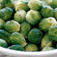 Brussel Sprouts · Brussels sprouts, caramelized onions with agave sliced almonds. Contains nuts.