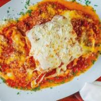 Lasagna · Meat lasagna in tomato sauce and ricotta cheese