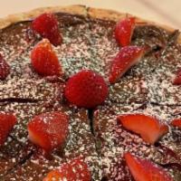 Pizza Dolci* · Nutella pizza with berries.