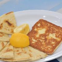 Saganaki · Pan-seared Greek cheese melted to perfection and served with lemon.
