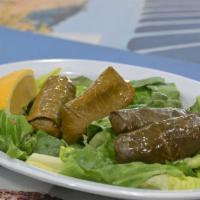 Dolmathakia · Stuffed grape leaves filled with rice and herbs.