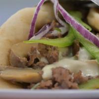 Classic Philly Steak · Shredded steak or chopped chicken with grilled onions, green peppers, mushrooms and melted A...