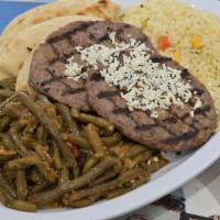 Bifteki Platter · Greek Style Black Angus beef patties char-grilled. Topped with Feta Cheese. Served with two ...