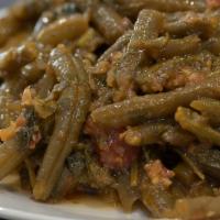 Greek Style Green Beans · Delicious green beans slow stewed in tomato sauce, onions, and herbs.