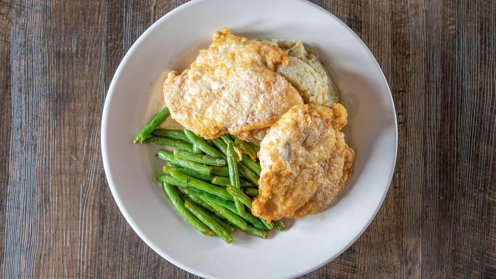 Pub Chicken · Fresh chicken breasts seasoned and pan fried served with mashed potatoes, green beans and drizzled with a lemon caper beurre Blanc.