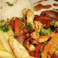 Pollo Saltado · Spiced white chicken breast sautéed with purple onions, green onions, tomatoes, and soy sauc...