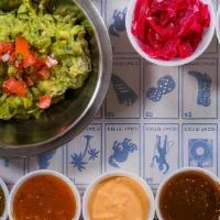 Coyo Guacamole · Hand smashed hass avocado, cilantro, pico de gallo and tortilla chips.