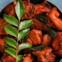 Railway Chicken Curry · Tender morsels of chicken cooked in a classic brown curry with Indian whole spices, served w...