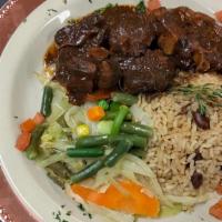 Oxtail · Short pieces of beef from the part of the tail, stewed in rich seasoning brown gravy, with b...