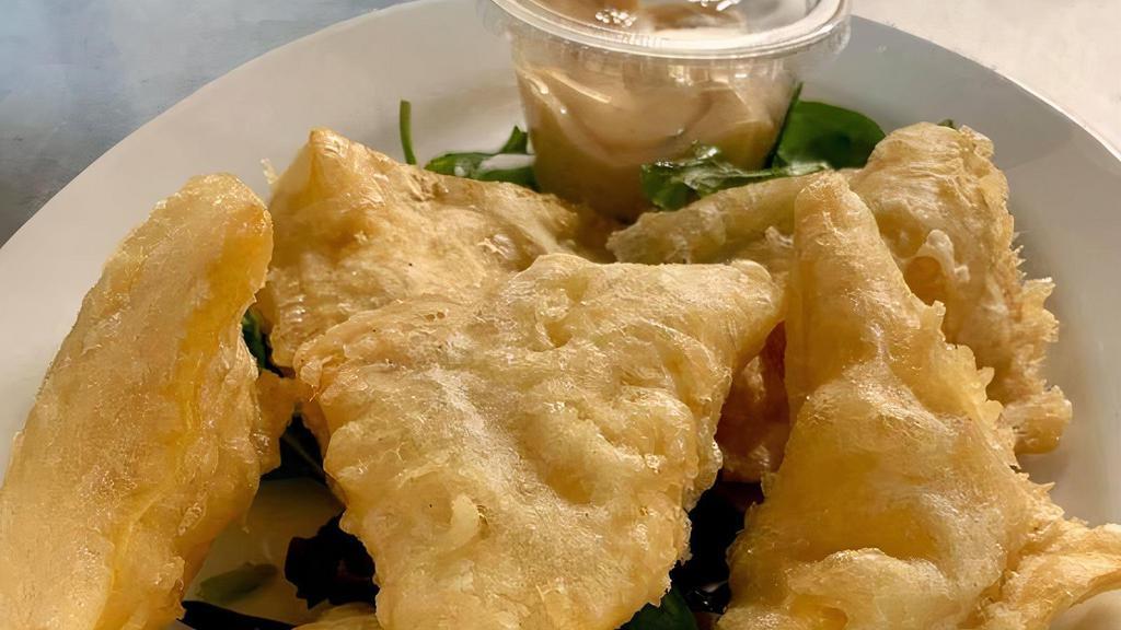Crispy Crab Wontons (6Pc) · Crab meat, cream cheese, jalapeños and green onions inside a lightly fried wonton and served with a side of sweet thai dipping sauce.