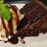 Chocolate Fudge Cake · Chocolate cake topped with vanilla ice cream and rich chocolate sauce.