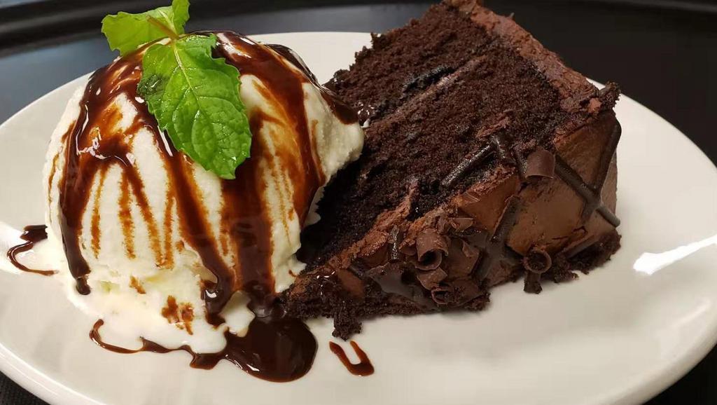 Chocolate Fudge Cake · Chocolate cake topped with vanilla ice cream and rich chocolate sauce.