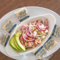 Ceviche Mixto · Fresh fish, shrimp squid marinated in lemon and herbs.