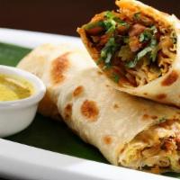 Chicken Tikka Wrap · Skewered chicken fried with green bell pepper, onions, and tomatoes wrapped in a roll.