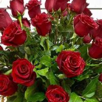 Love And Mom!!!! Three Dozen Long Stem Red Roses · These three dozen red roses, fillers and greens in a classic clear glass vase is romantic gi...