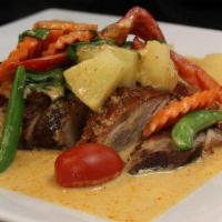 Kang Ped Roasted Duck · Boneless roasted duck with red curry, bell peppers, pineapple, snow peas, tomato, and basil ...