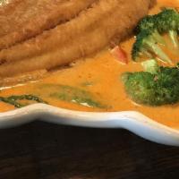 Spicy Catfish · Filet of catfish deep-fried, red bell pepper, and fresh basil leaves in curry sauce.