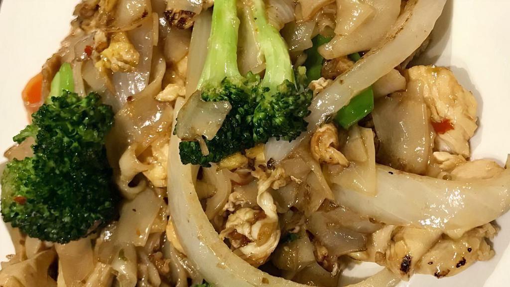 Drunken Noodles · Stir-fried rice noodle with a brown sauce, egg, basil, snow peas, onion, broccoli, and red peppers.