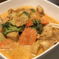 Thai Curry Noodles · Rice noodle in red curry sauce with coconut milk , broccoli, carrot, cabbage, red bell peppe...
