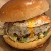 Money Burger · Mozzarella cheese, grilled onions, grilled jalapeños, egg, bacon, pineapple sauce, pink sauc...