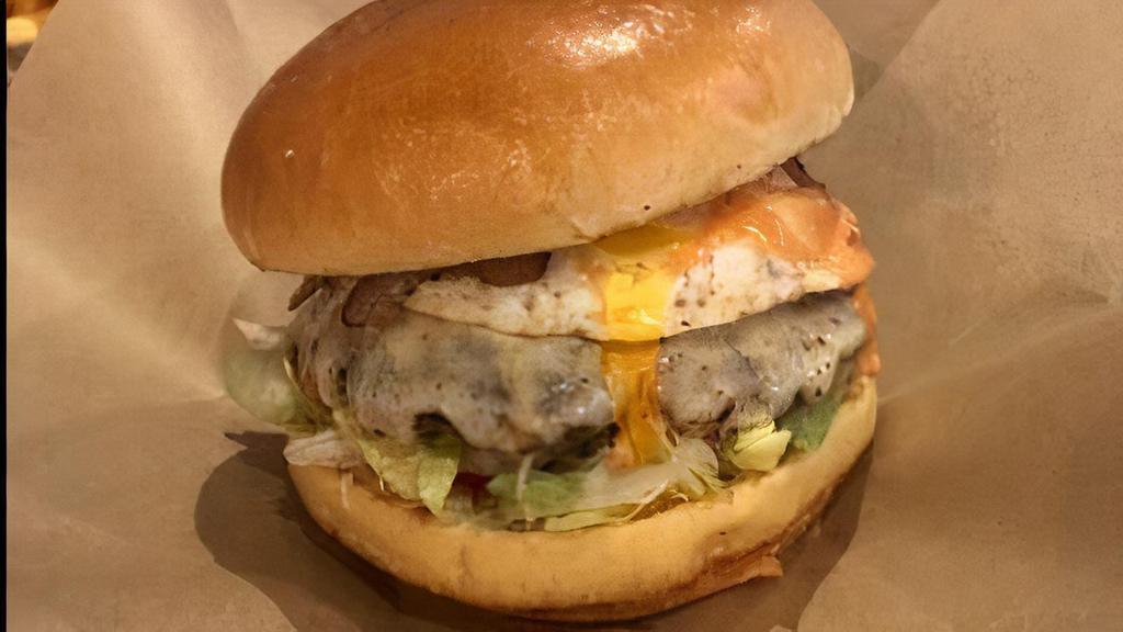 Money Burger · Mozzarella cheese, grilled onions, grilled jalapeños, egg, bacon, pineapple sauce, pink sauce, mustard, cilantro mayo, lettuce and tomato. Please, no changes. No exclusions.