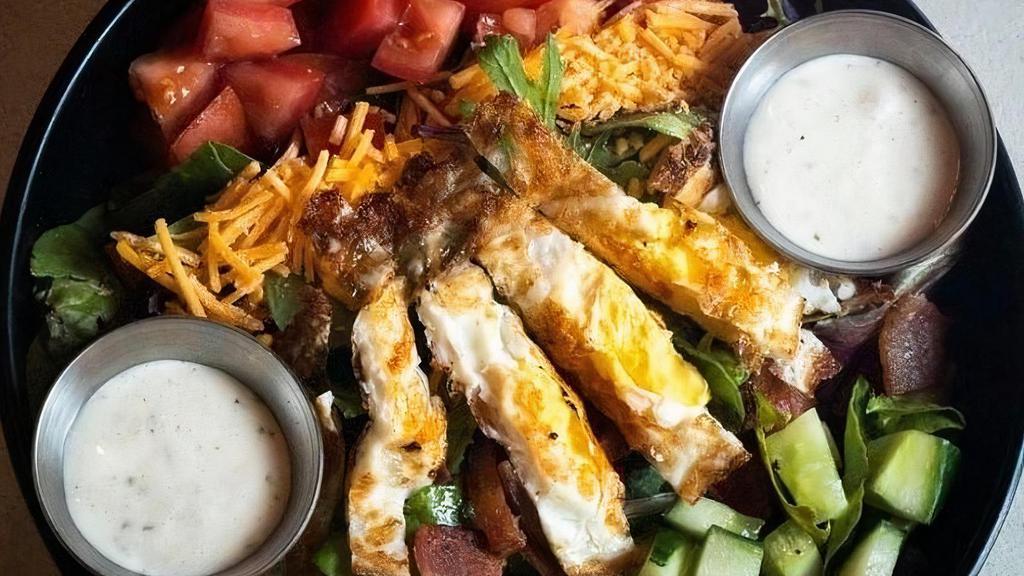 Cobb Salad · field greens, cucumber, cheddar cheese, bacon, tomatoes, fried egg, ranch dressing