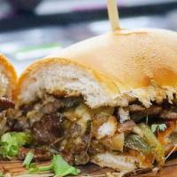 The Beast (Philly Cheesesteak) · Exceptionally tender sauteed top round steak with grilled onions and peppers, and melted che...