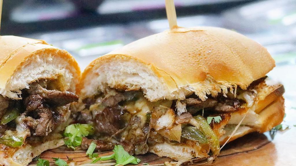 The Beast (Philly Cheesesteak) · Exceptionally tender sauteed top round steak with grilled onions and peppers, and melted cheese. Recommended cheese American or provolone.