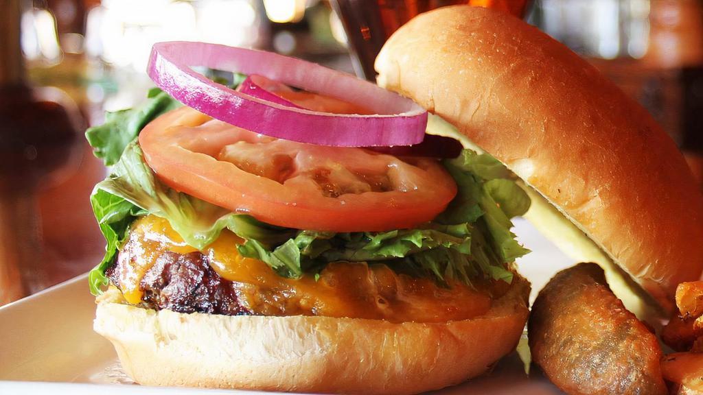 Pub Classic Burger · Eight ounces beef, lettuce, tomato, onion, brioche bun.