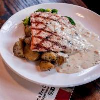 Grilled Salmon · Garlic roasted potatoes, broccoli, herb butter.