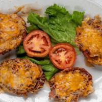Potato Skins · Stuffed with your choice of pork, chicken, or beef.