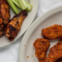 Hot Wings · Breaded and fried chicken wings. Served with your choice of ranch or blue cheese.