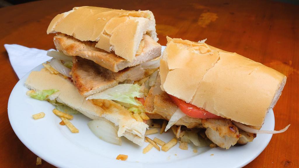 Chicken Sandwich · Lettuce, tomato, onion, potato sticks and mayonnaise on pressed Cuban bread.