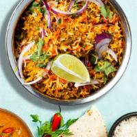 Chicken Biryani · Juicy chicken breasts cooked with Indian spices and basmati rice. Served with house raita.