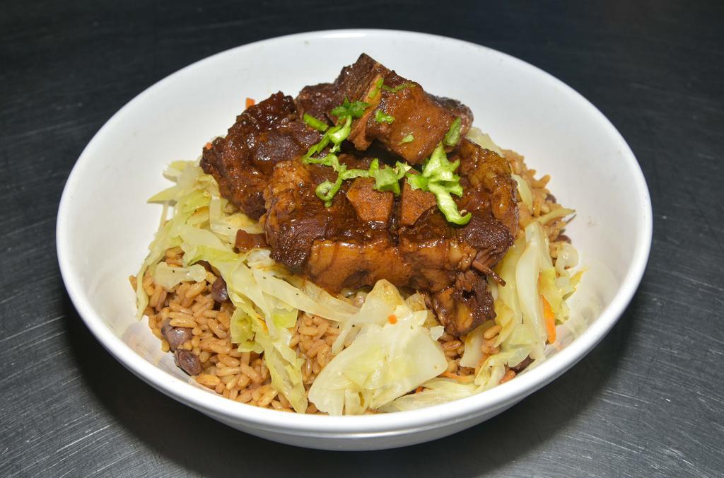 Oxtail · Served with one side and rice and peas or white rice.