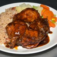 Brown Stew Chicken · Served with one side and rice and peas or white rice.