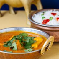 Chicken Curry · Cooked in wholesome spices in a delightful onion and tomato base.